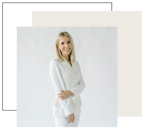 women wearing a white pant suit smiling